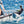 Load image into Gallery viewer, MiniCat 310 Sport on one pontoon being sailed on open water