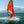 Load image into Gallery viewer, Red MiniCat 310 Sport being sailed fast