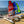 Load image into Gallery viewer, Red and Blue MiniCat 310 Sports beside a MiniCat Guppy on the beach