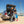 Load image into Gallery viewer, MiniCat Guppy being loaded into a trunk