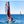 Load image into Gallery viewer, MiniCat 420 Red Evoque being sailed agressively on the water
