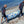 Load image into Gallery viewer, MiniCat Guppy being carried to the beach in a bag

